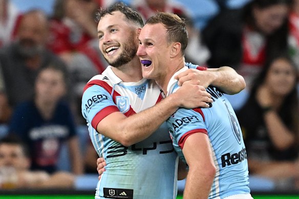 Roosters halves Daly Cherry-Evans and Sam Walker celebrate an Anzac Day try.