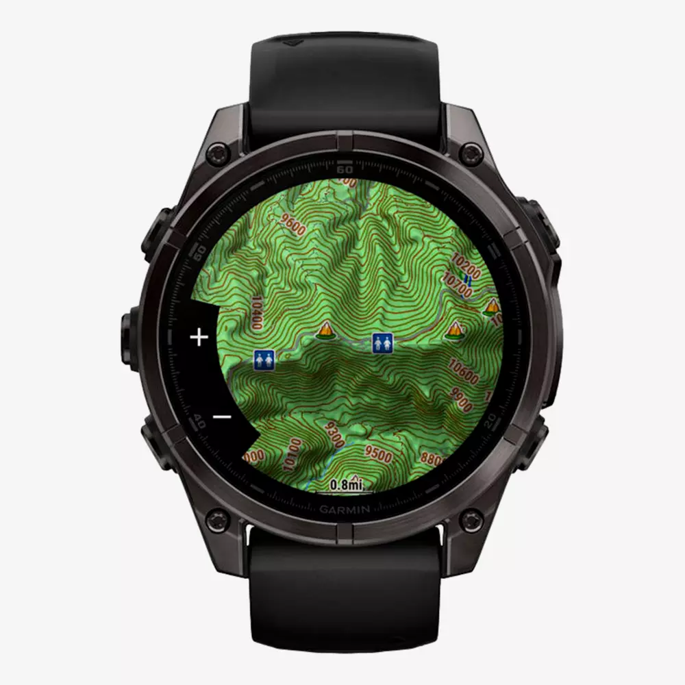 A black smartwatch displays a detailed topographic map with contour lines, elevation markers, hiking trail icons, and points of interest on its round screen—an ideal companion for outdoor adventures or pairing with the best golf shorts.