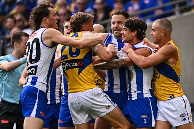 Jy Simpkin of the Kangaroos wrestles in the pack