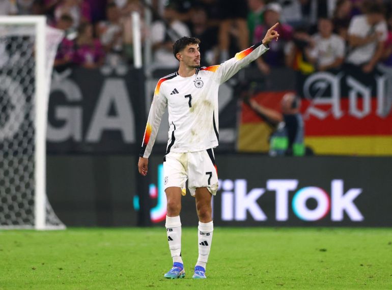 Kai Havertz raises his arm in celebration