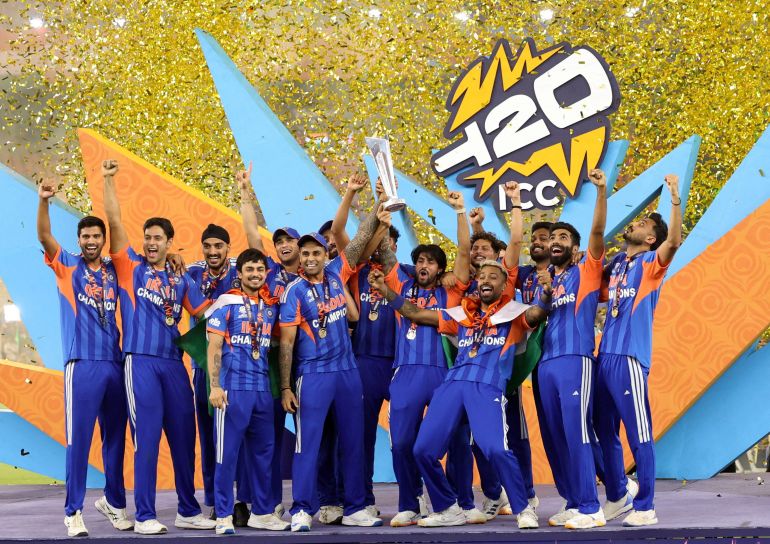 Cricket - ICC Men's T20 World Cup 2026 - Final - India v New Zealand - Narendra Modi Stadium, Ahmedabad, India - March 8, 2026 India's Suryakumar Yadav lifts the trophy as he celebrates with teammates after winning the ICC Men's T20 World Cup REUTERS/Amit Dave TPX IMAGES OF THE DAY