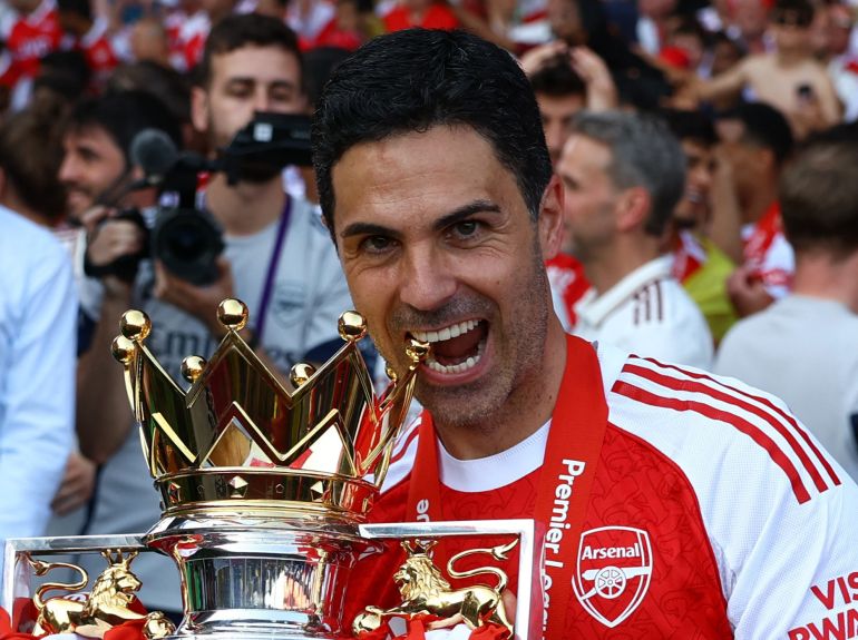 Soccer Football - Premier League - Crystal Palace v Arsenal - Selhurst Park, London, Britain - May 24, 2026 Arsenal manager Mikel Arteta celebrates with the trophy after winning the Premier League Action Images via Reuters/Matthew Childs EDITORIAL USE ONLY. NO USE WITH UNAUTHORIZED AUDIO, VIDEO, DATA, FIXTURE LISTS, CLUB/LEAGUE LOGOS OR 'LIVE' SERVICES. ONLINE IN-MATCH USE LIMITED TO 120 IMAGES, NO VIDEO EMULATION. NO USE IN BETTING, GAMES OR SINGLE CLUB/LEAGUE/PLAYER PUBLICATIONS. PLEASE CONTACT YOUR ACCOUNT REPRESENTATIVE FOR FURTHER DETAILS..