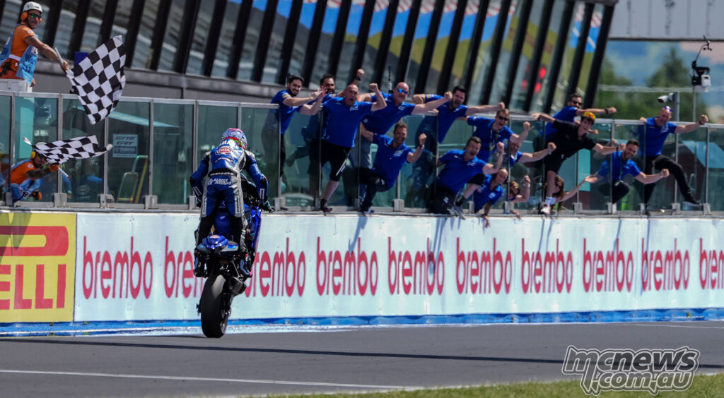 Albert Arenas performing a wheelie past the chequered flag after winning WorldSSP Race 2 at Misano.