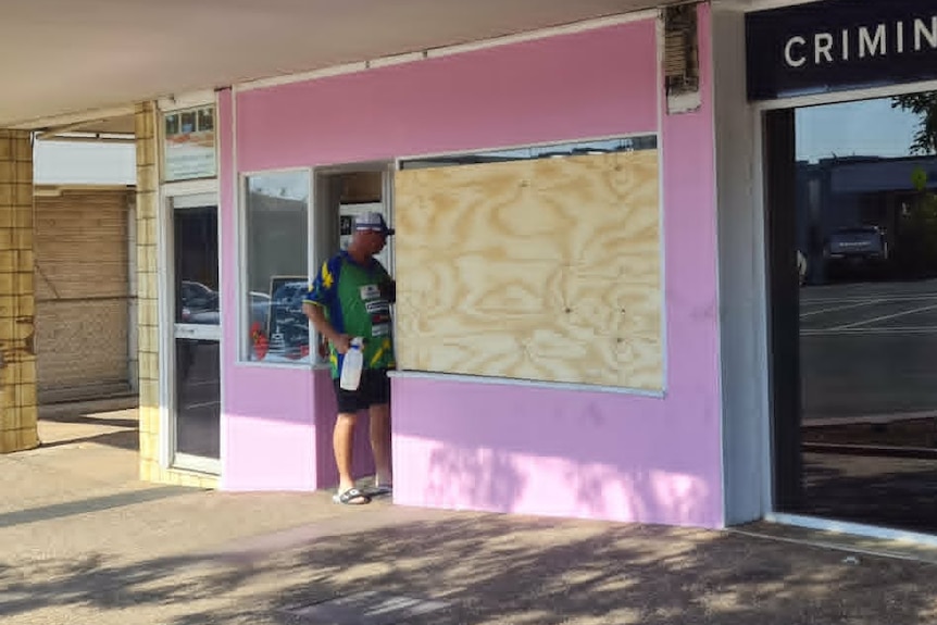 Boards cover the front window of Ishani Harney's Mount Isa business after a break-in in 2023.