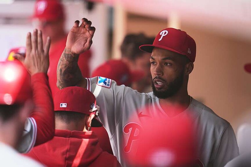 Philadelphia Phillies starting pitcher Cristopher Sánchez celebrates in the dugout after the last out of the seventh inning of a baseball game against the San Diego Padres Wednesday, May 27, 2026, in San Diego. (AP Photo/Gregory Bull)
