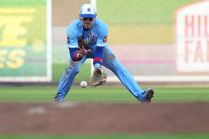 Kansas City Royals shortstop Bobby Witt Jr. fields a ground ball during the first inning of a baseball game against the Cincinnati Reds, Tuesday, June 2, 2026, in Cincinnati. (AP Photo/Kareem Elgazzar)