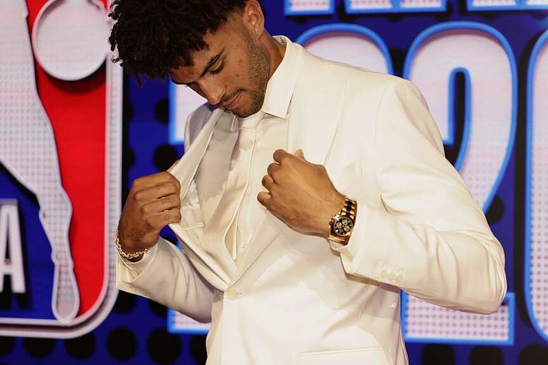 Cameron Boozer arrives for the first round of the NBA basketball draft Tuesday, June 23, 2026, in New York. (AP Photo/Adam Hunger)