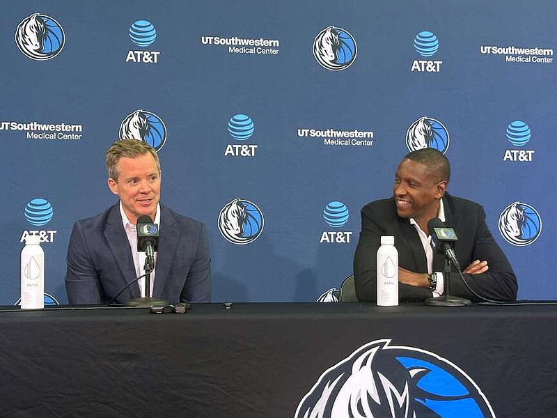 New Dallas Mavericks coach Dusty May, left, and Mavericks president of basketball operations Masai Ujiri, right, speak to the media during May's introductory NBA news conference in Dallas, Monday, June 29, 2026. (AP Photo/Schuyler Dixon)
