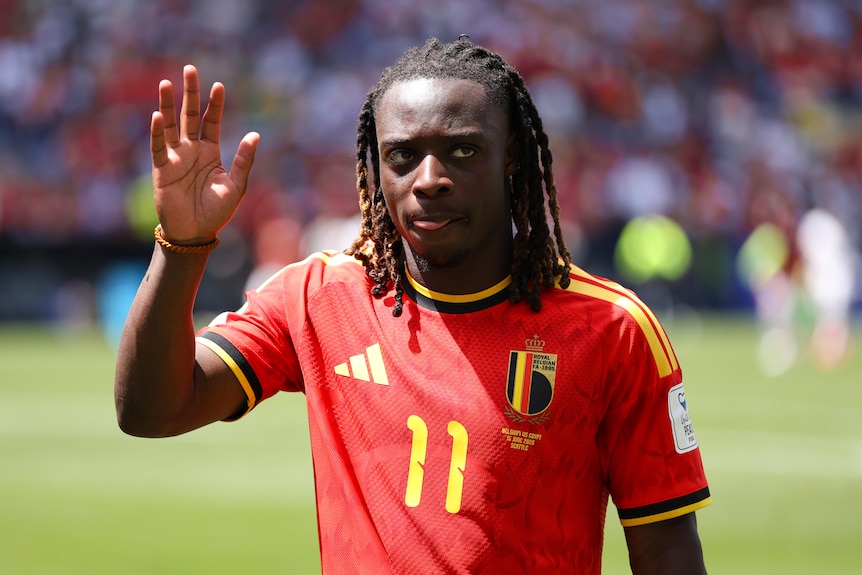 Jeremy Doku waves to the crowd during a Belgium game