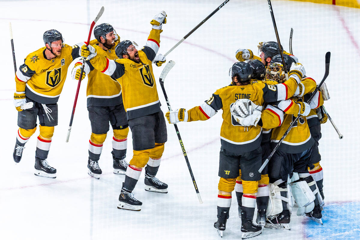 Golden Knights players celebrate their 2-1 win against the Colorado Avalanche during the third ...