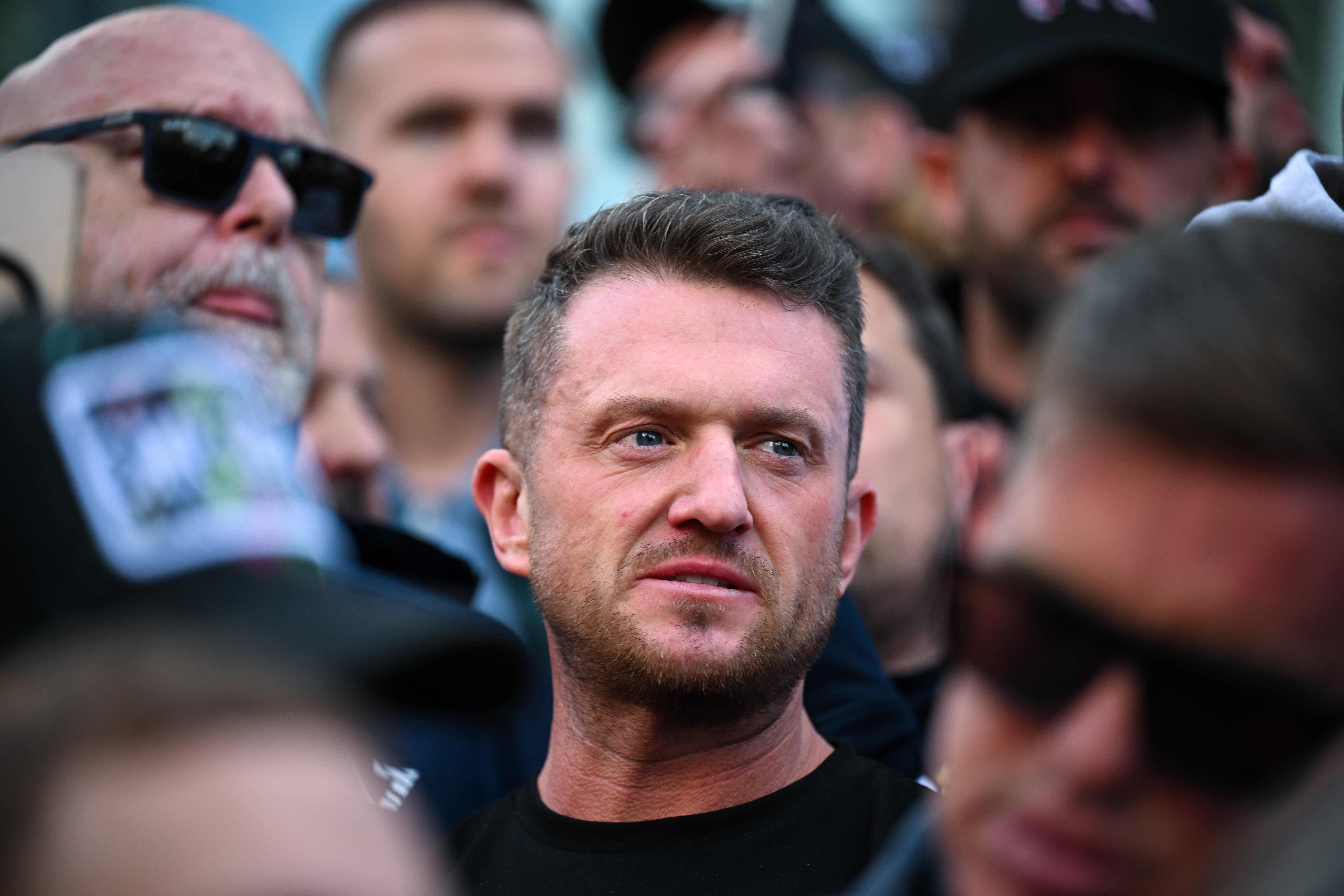 British far-right activist Tommy Robinson, real name Stephen Yaxley-Lennon, called for protests after the Belfast attack