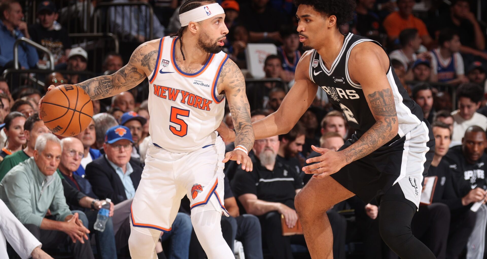 Jose Alvarado is guarded by Dylan Harper