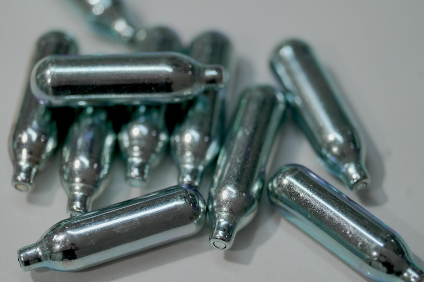 A collection of small metal bulbs.