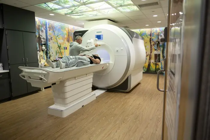Player getting into MRI machine
