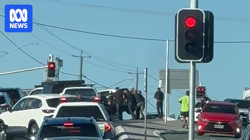 Motorcyclist who was trapped under car in Brisbane collision says bystanders saved his life