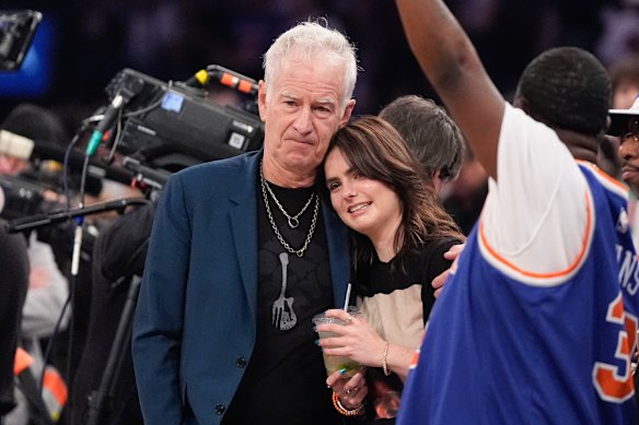 John McEnroe and his daughter at home at a Knicks game in Madison Square Garden.