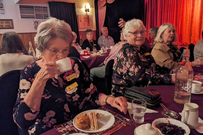 TR sipping tea