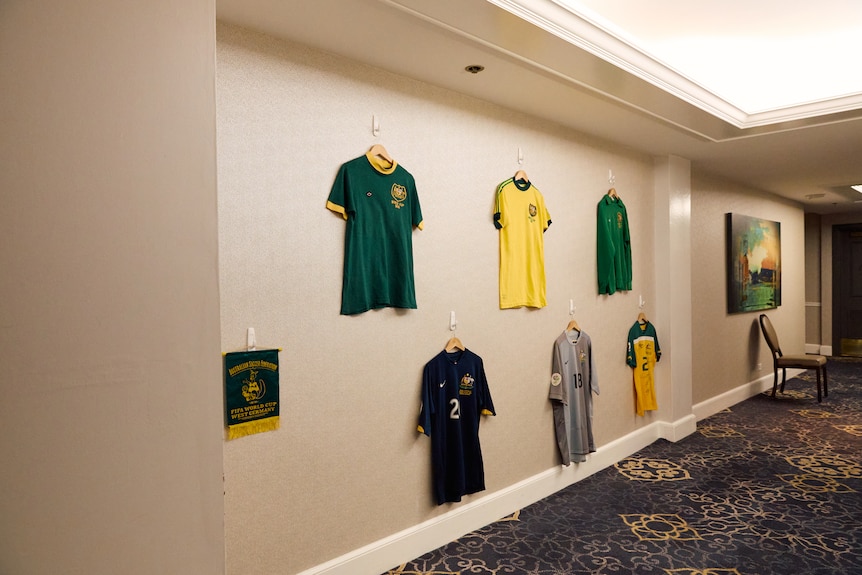 Socceroos jerseys from every World Cup campaign hang on the walls of the Claremont Country Club