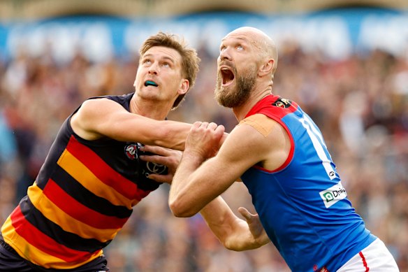 Lachlan McAndrew of the Crows competes with Max Gawn of the Demons.
