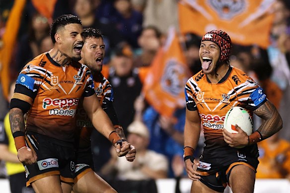 Jarome Luai celebrates one of his three second-half tries on Sunday.