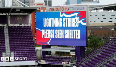 Big screen saying 'lightning strikes please seek shelter'