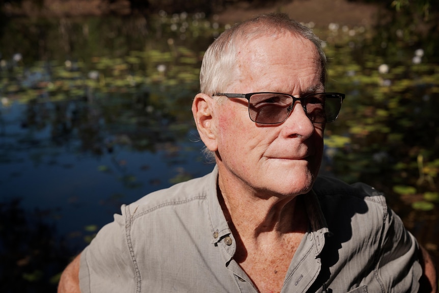Robert Wesley-Smith standing in front of a small lake.