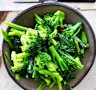 Three broccolis in garlic oil.