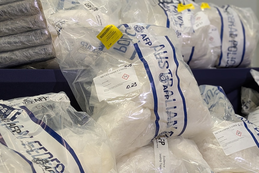 Evidence bags with large amounts of a white crystal substance in them.
