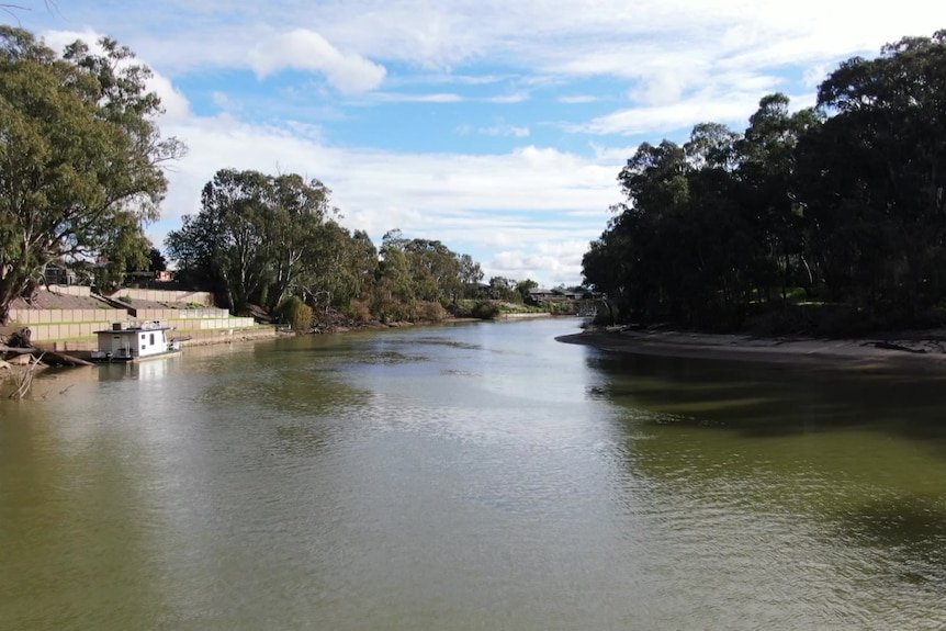 A houseboat floats on the Edward River.