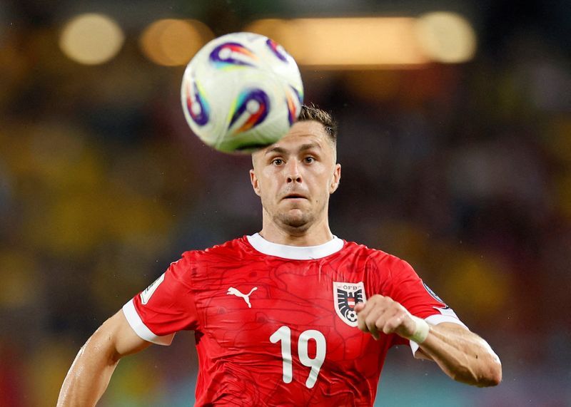 Football: Soccer-Austria stick with World Cup squad after Baumgartner injury