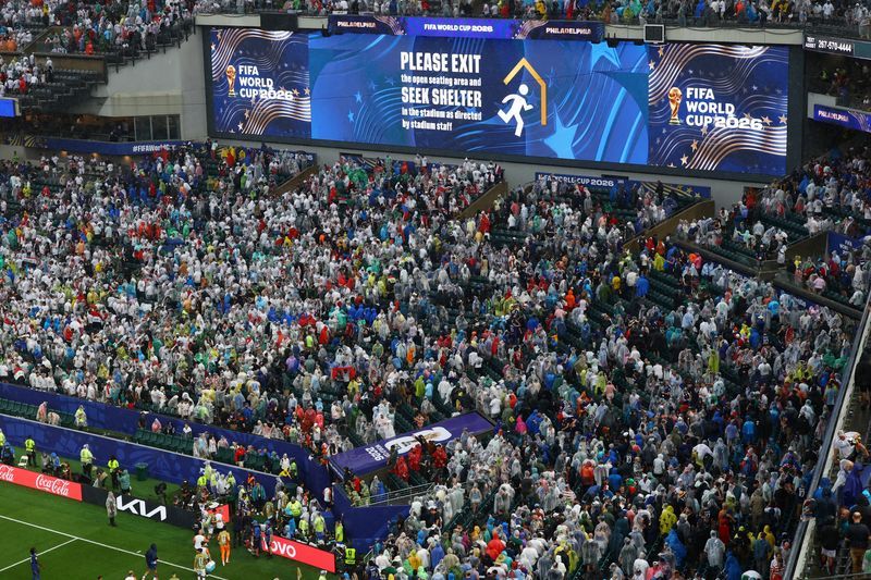 Football: Soccer-France v Iraq World Cup game resumes after lengthy weather delay