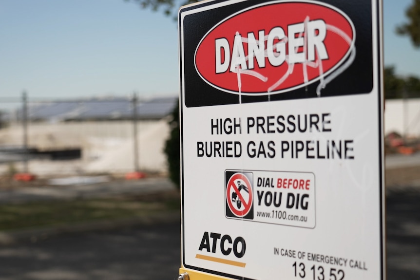 A 'danger' sign warning of a high pressure buried gas pipeline.