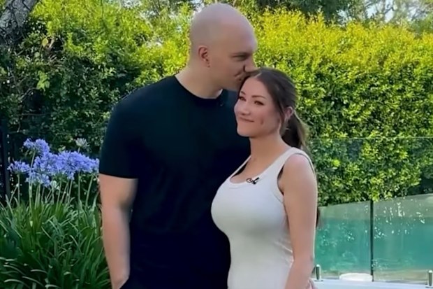 OnlyFans creator Quinn Everly with her husband Alex Everly. The couple own the Blue Rose Agency. 