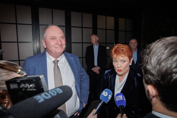 Barnaby Joyce and Pauline Hanson talk to reporters outside the One Nation fundraising function in Melbourne on Friday.