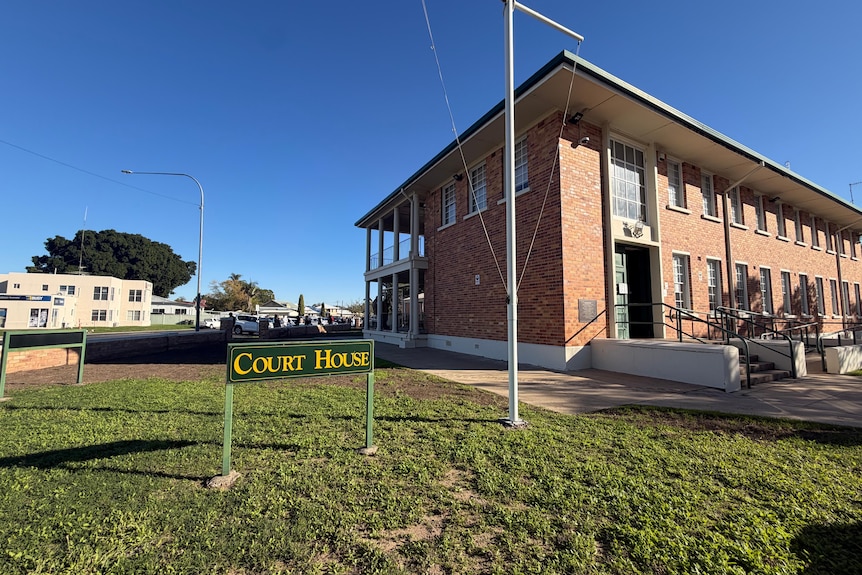 An old brick court building in Goondiwindi on a clear day.