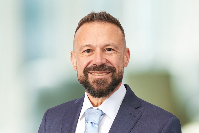 John Gualtieri Officeworks Managing DIrector looks at the camera smiling