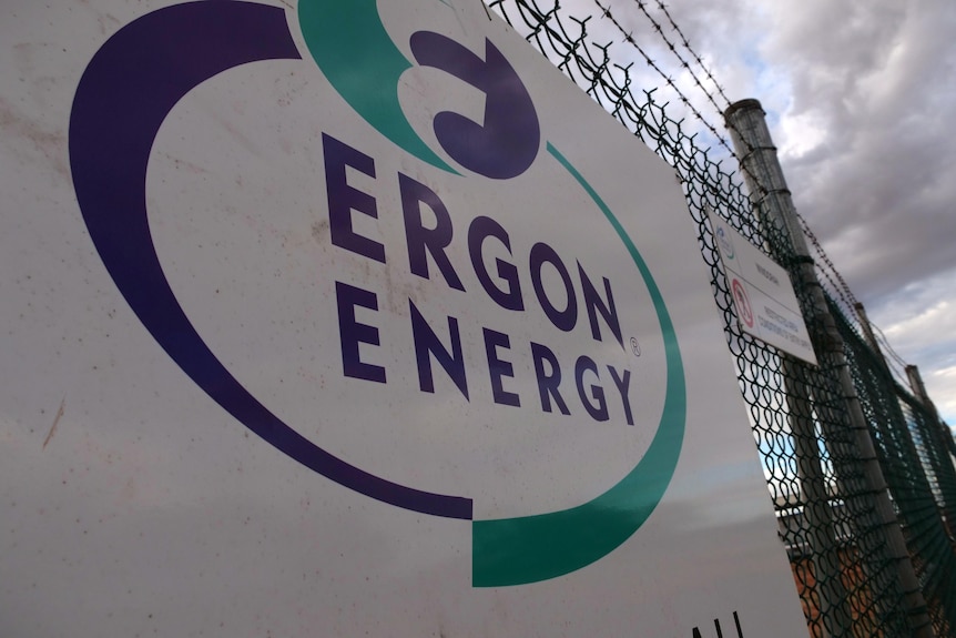 Sign with Ergon logo hanging on fence.
