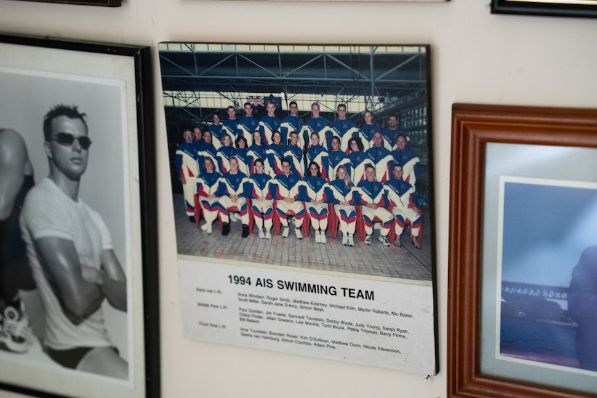 A framed photo of young athletes lined up for a class picture. Below it is a list of their names.