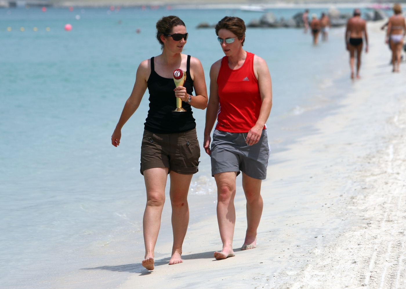 Beach belles: Edwards, armed with her ICC Women's Cricketer of the Year award, in Dubai with Claire Taylor in 2008 Beach belles: Edwards, armed with her ICC Women's Cricketer of the Year award, in Dubai with Claire Taylor in 2008