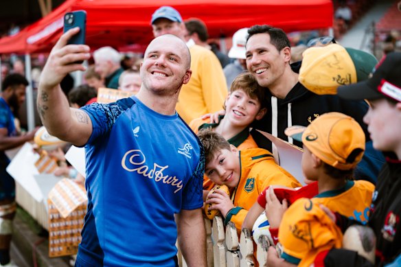 Dylan Pietsch takes a photo with fans after an open traning session at North Sydney Oval.