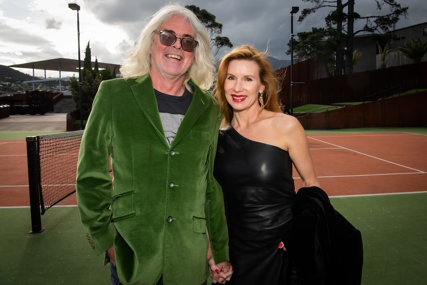 David Walsh and Kirsha Kaechele stand near the tennis court at Mona.