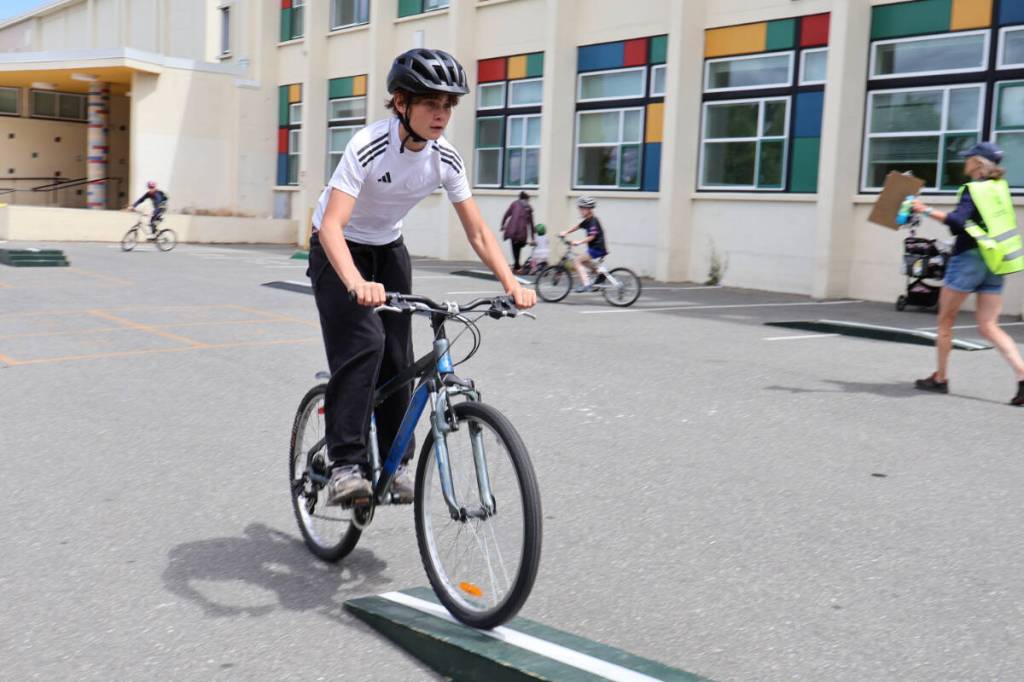 Children practise cycling skills during a free bike safety program at Central Middle School on Saturday. (Nikhil Nikhil/Victoria News)