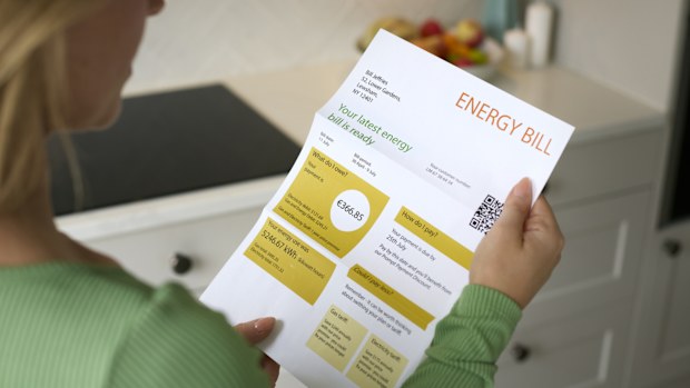 Close Up Of Woman Opening Euro Energy Bill During Cost Of Living Crisis