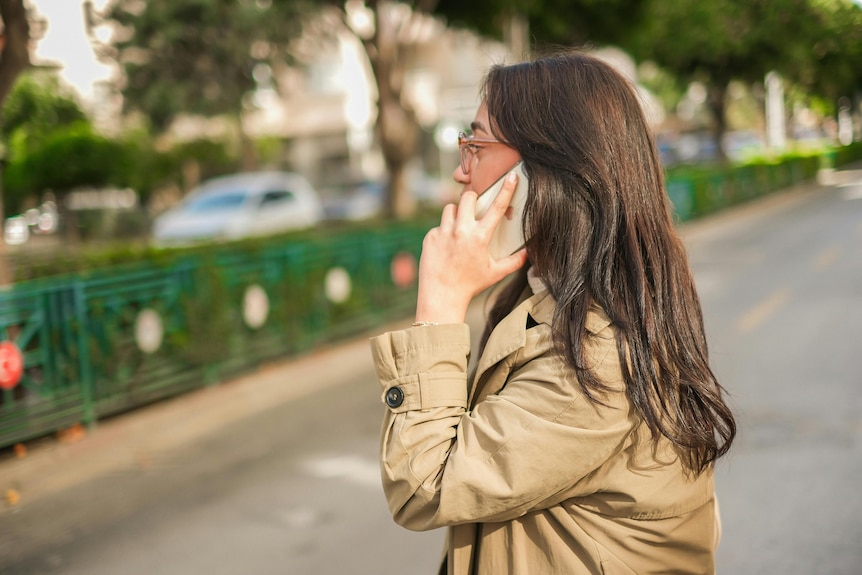 An unidentified woman on the phone
