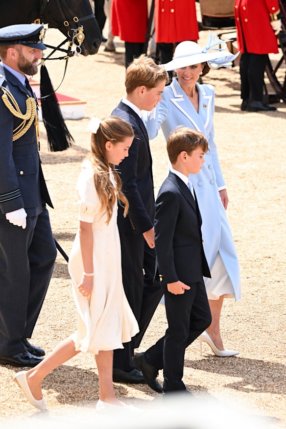 Princess Charlotte, in an Alessandra Rich dress, with Prince George, Prince Louis and Catherine, Princess of Wales, at Trooping the Colour.