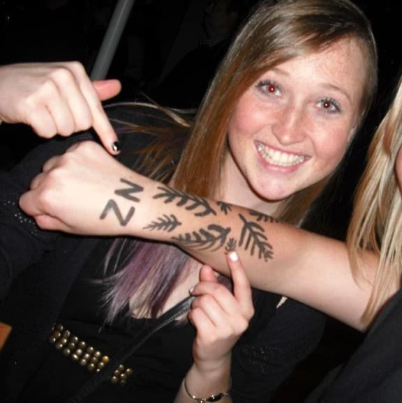 Erica Hume celebrates an All Blacks game in 2013, one year before she died by suicide at Palmerston North Hospital aged 21.