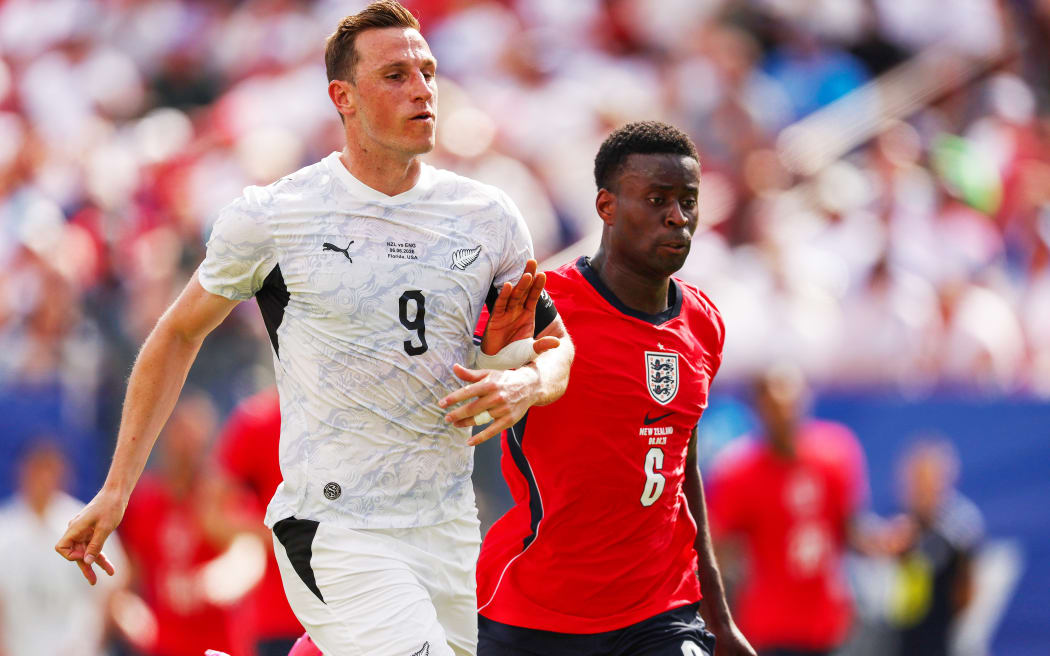 Chris Wood captain of New Zealand and Marc Guehi of England.