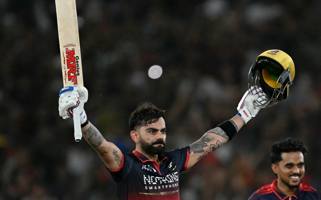 Royal Challengers Bengaluru's Indian cricket player Virat Kohli (L) celebrates after his team's win against Gujarat Titans at the end of the 2026 Indian Premier League (IPL) T20 final match in the Narendra Modi Stadium of Ahmedabad on May 31, 2026. (Photo by Shammi MEHRA / AFP) / -- IMAGE RESTRICTED TO EDITORIAL USE - STRICTLY NO COMMERCIAL USE --