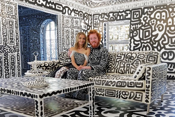 Mr and Mrs Doodle, aka Sam and Alena Cox, in their Doodle house.