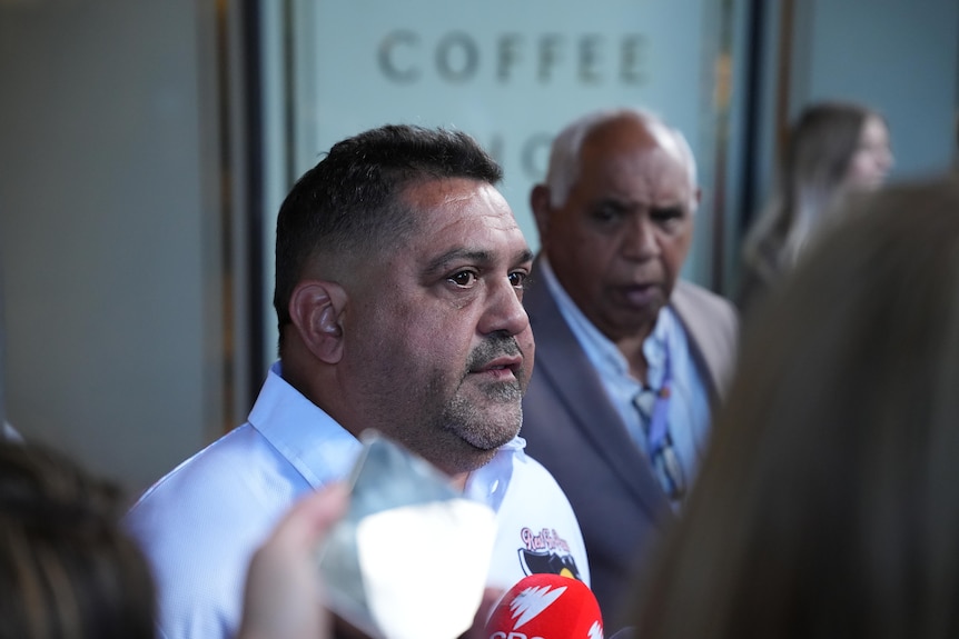 Jai Wright father speaking outside court with microphones in front of him